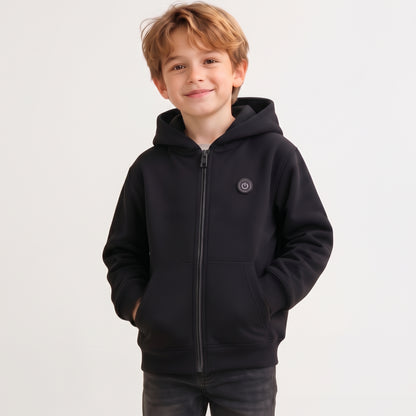 Smiling boy wearing a classic black 7-zone smart heated zip-up hoodie for winter